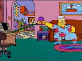 Homer Simpson operating a computer